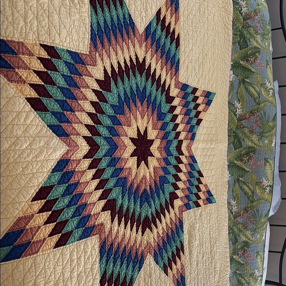 Antique (circa 1900-1940) hand stitched star pattern quilt